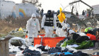 South Korean rescuers check the wreckage of the passenger plane at Muan International Airport.