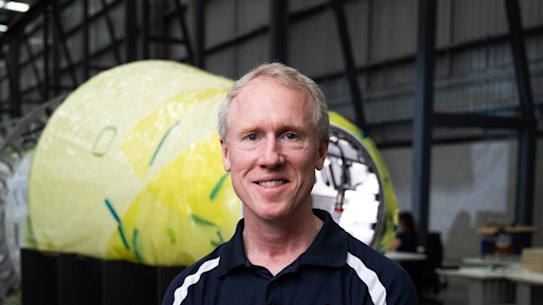 Adam Gilmour, CEO of Gilmour Space, is photographed next to the test vehicle they intend of launching this year at the company’s facility on the Gold Coast.