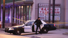 A police officer gets out of his vehicle near a ballroom dance club in Monterey Park on Sunday.