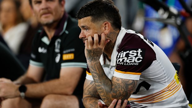 Adam Reynolds looks on from the bench after being injured in the grand final. Brisbane were lucky to hang on with a reshuffled backline.