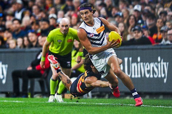 Murphy Reid gets away from James Peatling of the Crows during round four.