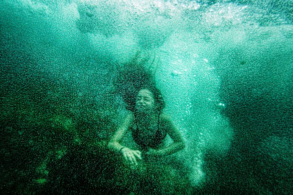 A swimmer cools off at Clovelly on a hot summer day.