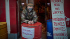Yves Barruet protests new COVID-19 restrictions outside his closed bar in Paris.