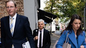 Stuart Suthern-Brunt (centre) outside the Independent Commission Against Corruption hearing on Tuesday.