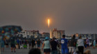 Locals in Florida watch a SpaceX rocket launch carrying next-generation Starlink satellites, which will power Optus’ Australia-wide network.