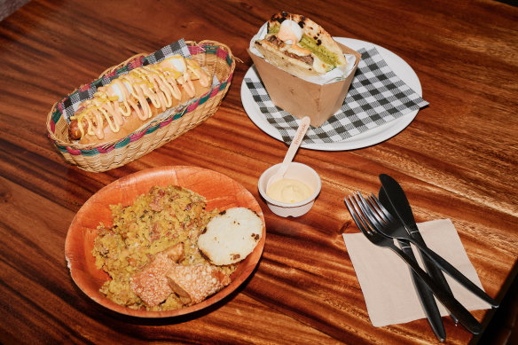 Lechona Berbeo, hot dogs squiggled with pineapple sauce and mayo, and burgers made with arepas at Berbeo Bros.