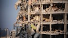 sraeli security forces inspect a destroyed building that was hit by a missile fired from Iran.