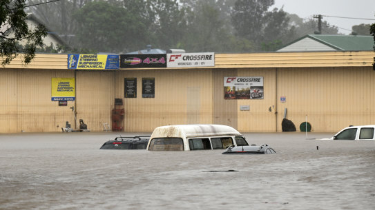 Floodwater inundates cars in Lismore on Wednesday.