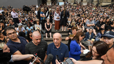 Aiia Maasarwe's father Saeed (centre) joined a vigil at Parliament House on Friday night for his daughter, attended by more than 1000 people.
