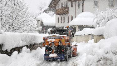 A snow plough cleans a street in Berchtesgaden, southern Germany.