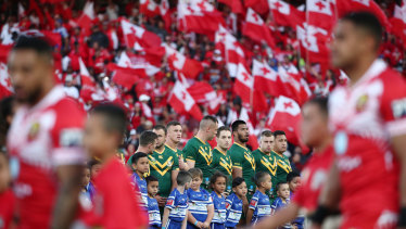 The Kangaroos surrounded by red and white flags before kick-off.