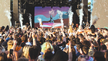 A crowd listens to music at FOMO festival in 2019.