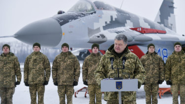Ukrainian President Petro Poroshenko addresses the Armed Forces of Ukraine at the military airfield in the Vasylkiv region, Ukraine, on Saturday.