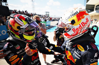 Race winner Max Verstappen and third-placed Red Bull teammate Sergio Perez celebrate in Texas.