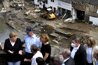 German Chancellor Angela Merkel (left) meets local and regional officials in Schuld, western Germany.