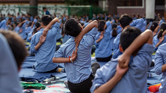 Tibetan student practise yoga at the Tibetan Children's Village School in Dharmsala, India