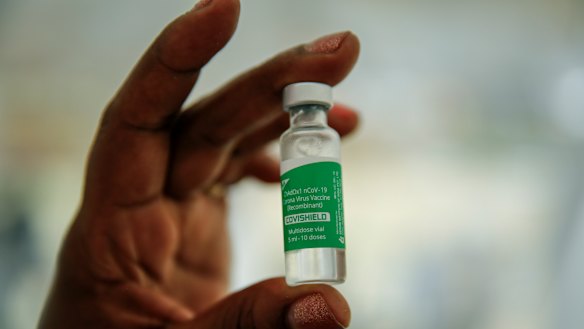 A nurse holds a vial of the AstraZeneca COVID-19 vaccine manufactured by the Serum Institute of India and provided through the global COVAX initiative to other countries.