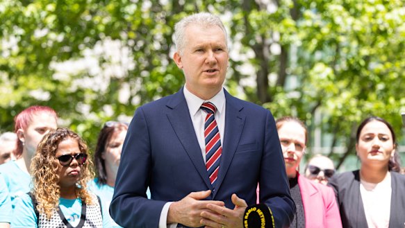 Burke stood with early educators at Parliament House after the industrial relations bill passed the lower house on Thursday.