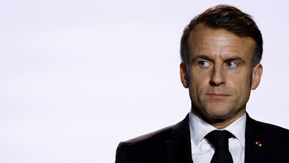 French President Emmanuel Macron reacts as he delivers his New Year speech to the French Army as he visits at the Digital Support and Cyber Command (CATNC) of the French Army, in Cesson-Sevigne, western France.