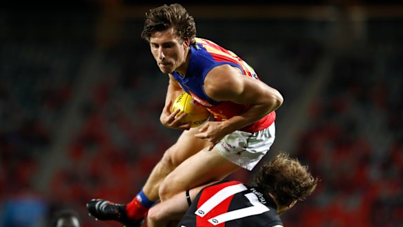 Making his mark: Noah Answerth flies over Essendon's James Stewart.