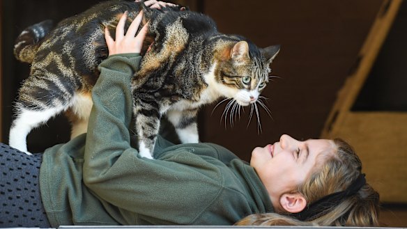 Zoe Knowles and her cat, Tiger Pi at  home in Petersham.