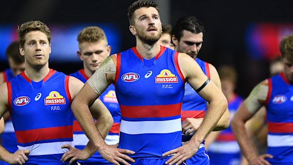 Marcus Bontempelli and his Western Bulldogs teammates following their loss to Port Adelaide at Marvel Stadium.