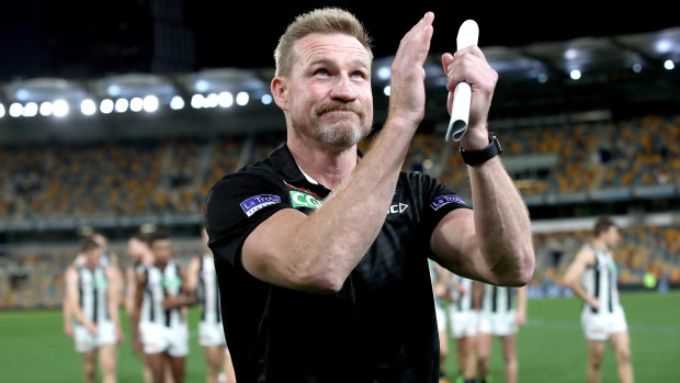 Back on track: Collingwood coach thanks the Gabba crowd after the win over Carlton.