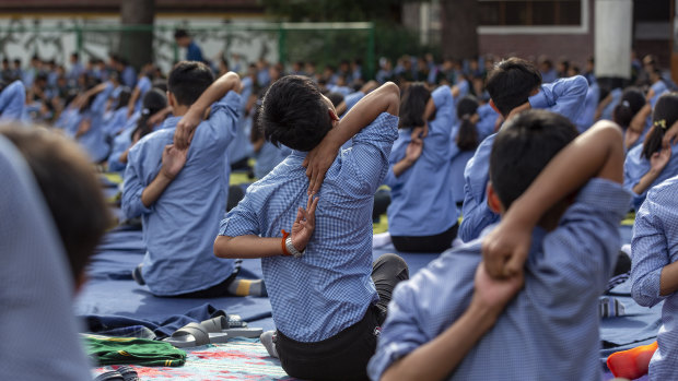 Tibetan student practise yoga at the Tibetan Children's Village School in Dharmsala, India