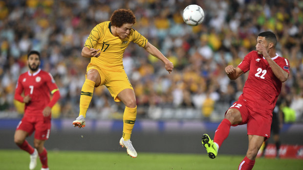 New face in the engine room: Mustafa Amini competes for possession against Bassel Jradi.