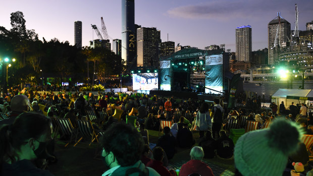 Crowds watch the announcement of Brisbane’s win.