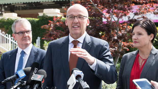 NSW Labor Leader Luke Foley, flanked by Deputy Leader, Michael Daley, and Jodi McKay, Shadow Minister for Transport, at a press conference at Strathfield Train Station.