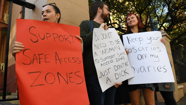 Demonstrators in favour of no-go zones around NSW abortion clinics stand outside NSW State Parliament on Thursday. 