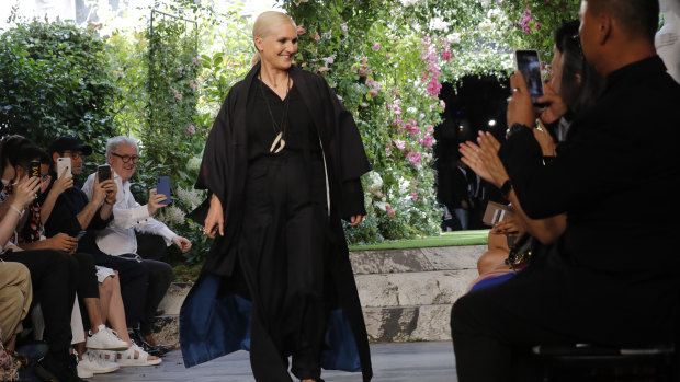 Designer Maria Grazia Chiuri accepts applause at the end of the Dior Haute Couture Fall-Winter 2020 fashion collection presented in Paris on Monday July 1, 2019. 