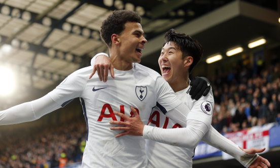 Tottenham\'s Dele Alli celebrates with Son Heung-min after scoring his side\'s second goal against Chelsea at Stamford Bridge on Sunday.
