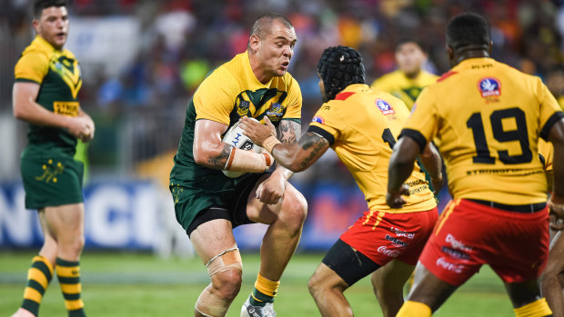 On the front foot: David Klemmer runs into some willing Kumuls defence.