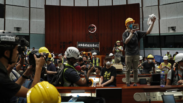 Students break into the Hong Kong Legislative Chamber to protest against an extradition bill in July 2019.