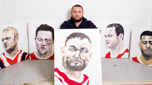 Jared Waerea-Hargreaves with the paintings of players which will be auctioned post-season.