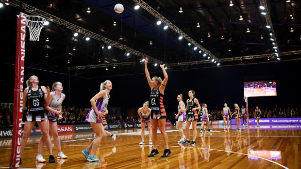 On target: Collingwood's Erin Bell send a shot goalward against Queensland at the Silverdome in Launceston on Sunday.