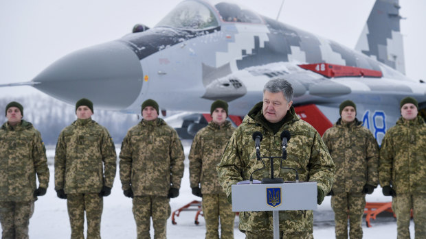 Ukrainian President Petro Poroshenko addresses the Armed Forces of Ukraine at the military airfield in the Vasylkiv region, Ukraine, on Saturday.
