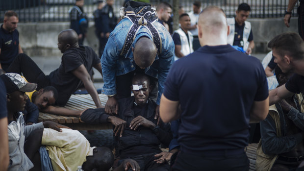 A migrant is injured after minor clashes with French police officers at the Panthenon in Paris.