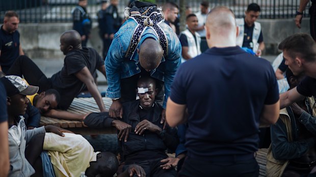 A migrant is injured after minor clashes with French police officers at the Panthenon in Paris.