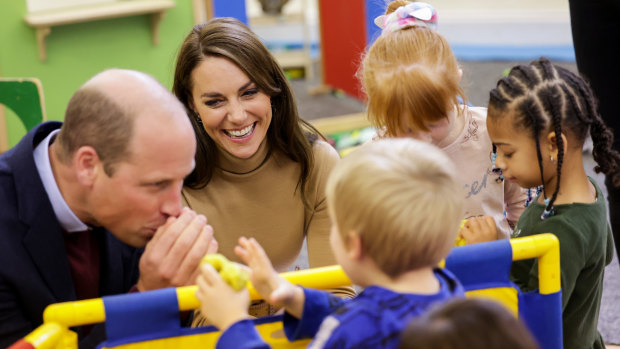 William and Catherine, Prince and Princess of Wales, and children play with playdough at The Rainbow Centre in Scarborough.