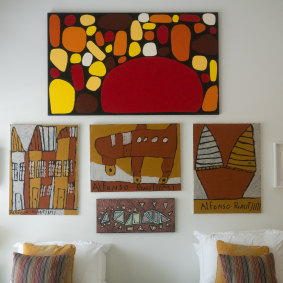 Above the bed, from the top, work by Keturah Zimran, Tiwi artist Alfonso Puautjimi and Glenda Poulson.