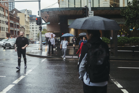 Sydneysiders were forced to run for cover amid heavy downpours in the CBD.