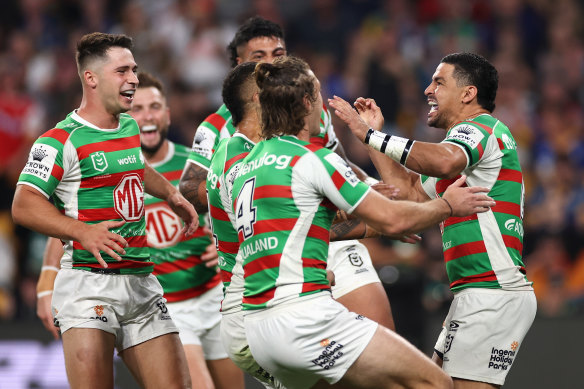 Cody Walker (right) celebrates with teammates after scoring a try after a pinpoint Latrell Mitchell kick.