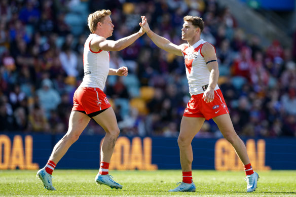 Taylor Adams of the Swans celebrates a goal during their narrow loss to Brisbane at The Gabba.