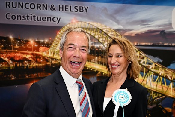 Nigel Farage and Sarah Pochin of the Reform Party celebrate as the latter is declared the winner of the Runcorn and Helsby byelection.