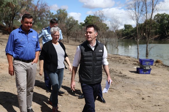 Premier Chris Minns (right) in his North Face vest on Wednesday.