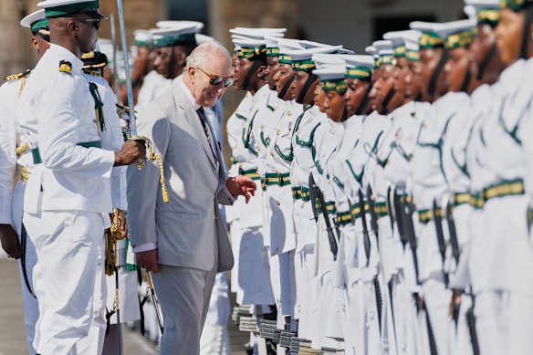 Charles inspects an honour guard of the Royal Bahamas Defence Force.