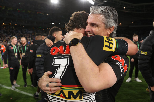 Panthers coach Ivan Cleary and son Nathan embrace after last year’s grand final win over Parramatta.